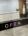 Modern interior with a 'OPEN' sign on a counter
