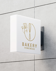 Bakery shop front signage projecting from wall