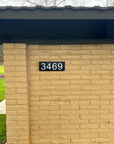 Custom 3D backlit address sign displaying number 5250 on stone facade