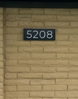 Front porch lighting idea featuring a custom illuminated address sign