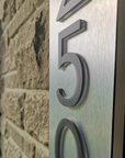 Illuminated front porch address sign with vertical number layout for high visibility at night