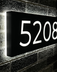 Large backlit address plaque displaying 5 digits for clear street visibility