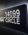 Modern curb appeal exterior lighting idea using custom illuminated address signage