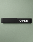 Modern Open / Closed slider sign in matte black with OPEN showing