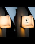 Outdoor LED cube sign hanging above cafe entrance with warm white light