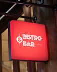 Red illuminated bar sign square shape for nightlife visibility
