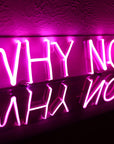 Pink motivational neon wall art sign reading Why Not Now for office or bedroom