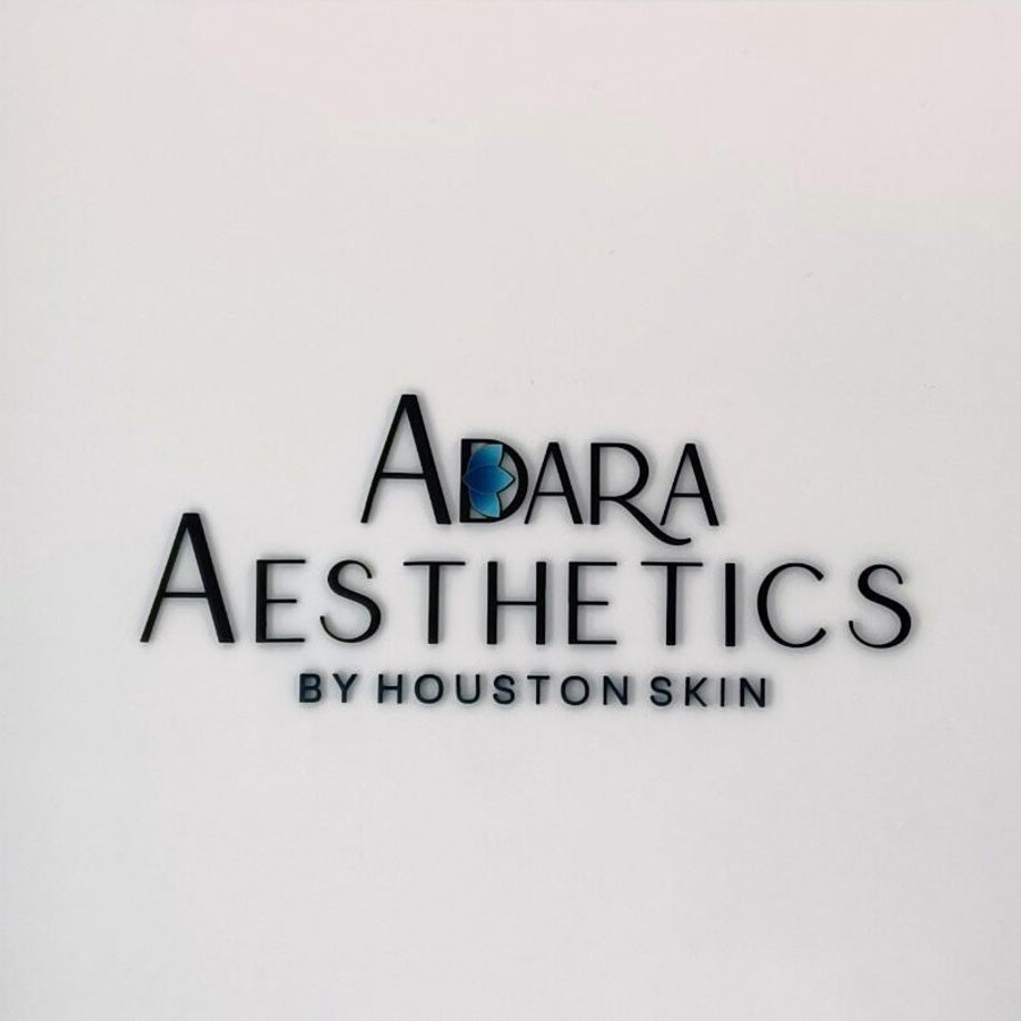 Large custom 3D dimensional wall sign featuring elegant black serif lettering on a clean white interior wall.