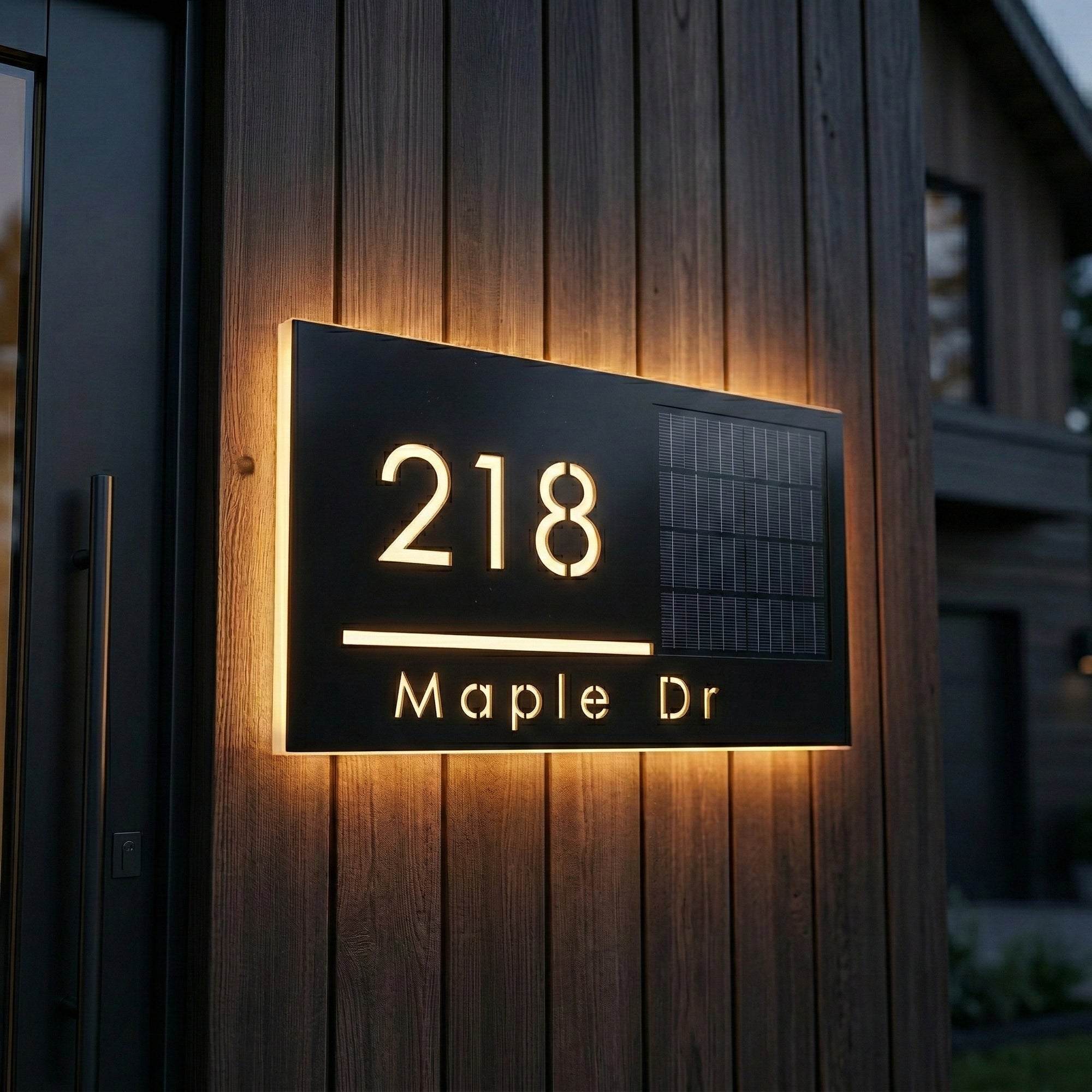 Custom solar LED address sign with illuminated house numbers and street name mounted on exterior wall
