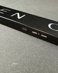 Black door handle with 'open' and 'close' labels on a metallic surface