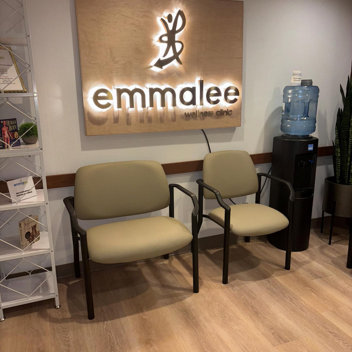 Large custom 3D dimensional wall sign featuring elegant black serif lettering on a clean white interior wall.