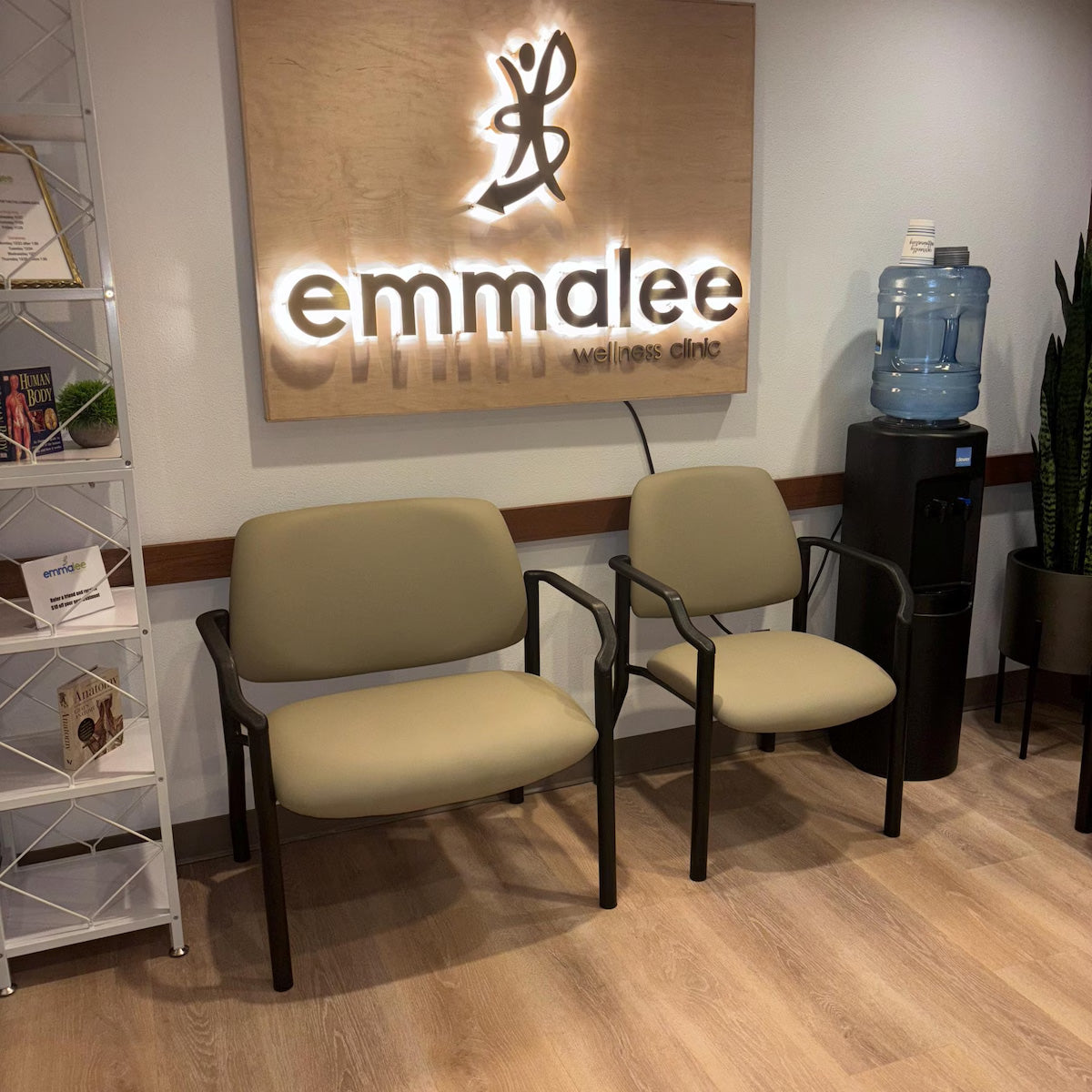 Large custom 3D dimensional wall sign featuring elegant black serif lettering on a clean white interior wall.