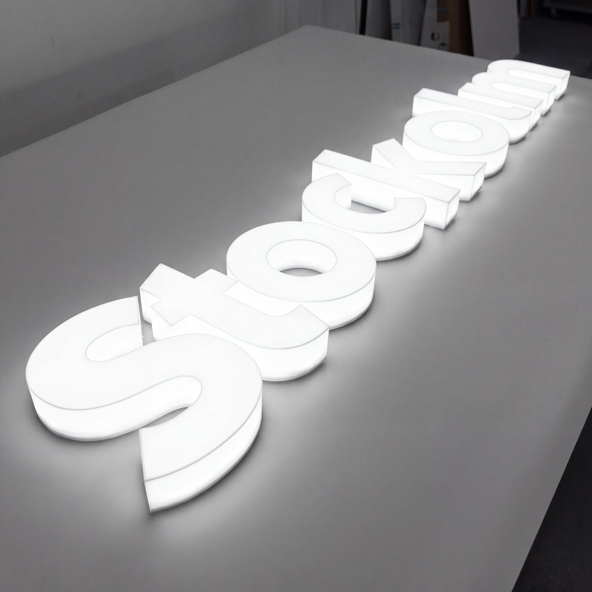 Full lit 3D acrylic letter sign with edge-to-edge illumination on a storefront