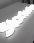 Full lit 3D acrylic letter sign with edge-to-edge illumination on a storefront