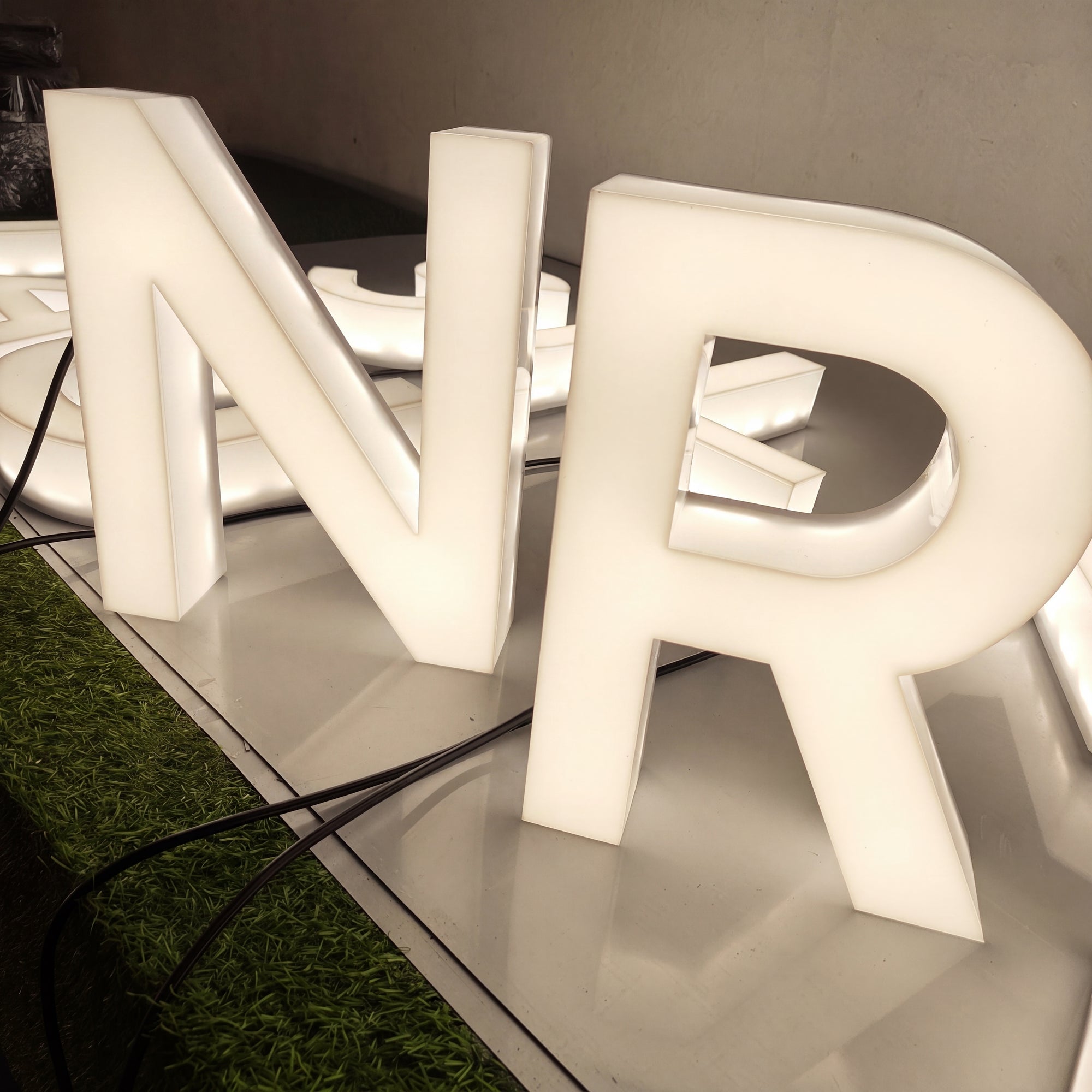 Light-diffusing acrylic letters with a soft, even storefront glow