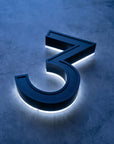 Solar house number 3 in daytime showing matte black solar panel face