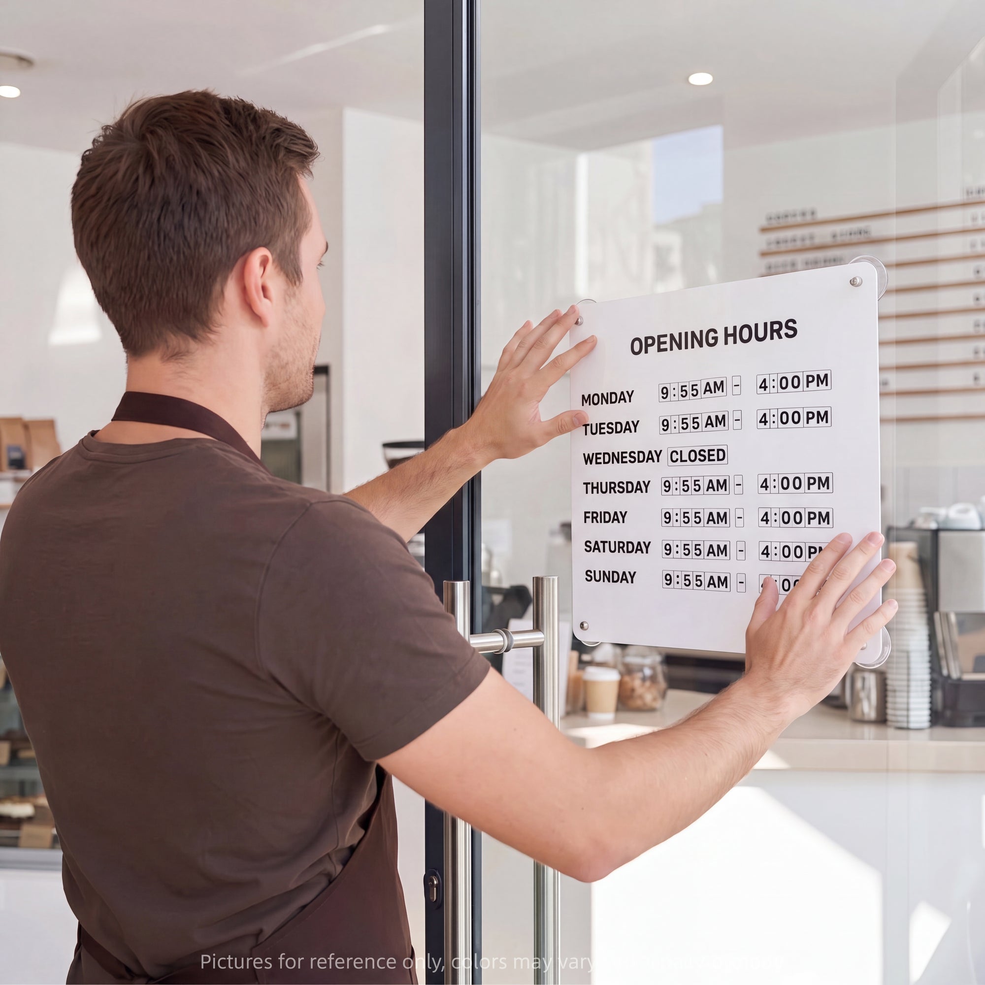OPENING HOURS' onto a glass door in a bright, modern cafe or restaurant.