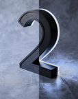 Solar house number light, stainless steel with a self-charging solar panel face