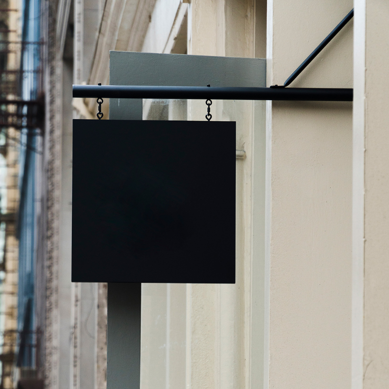 Blank white metal sign ready for custom vinyl logo application