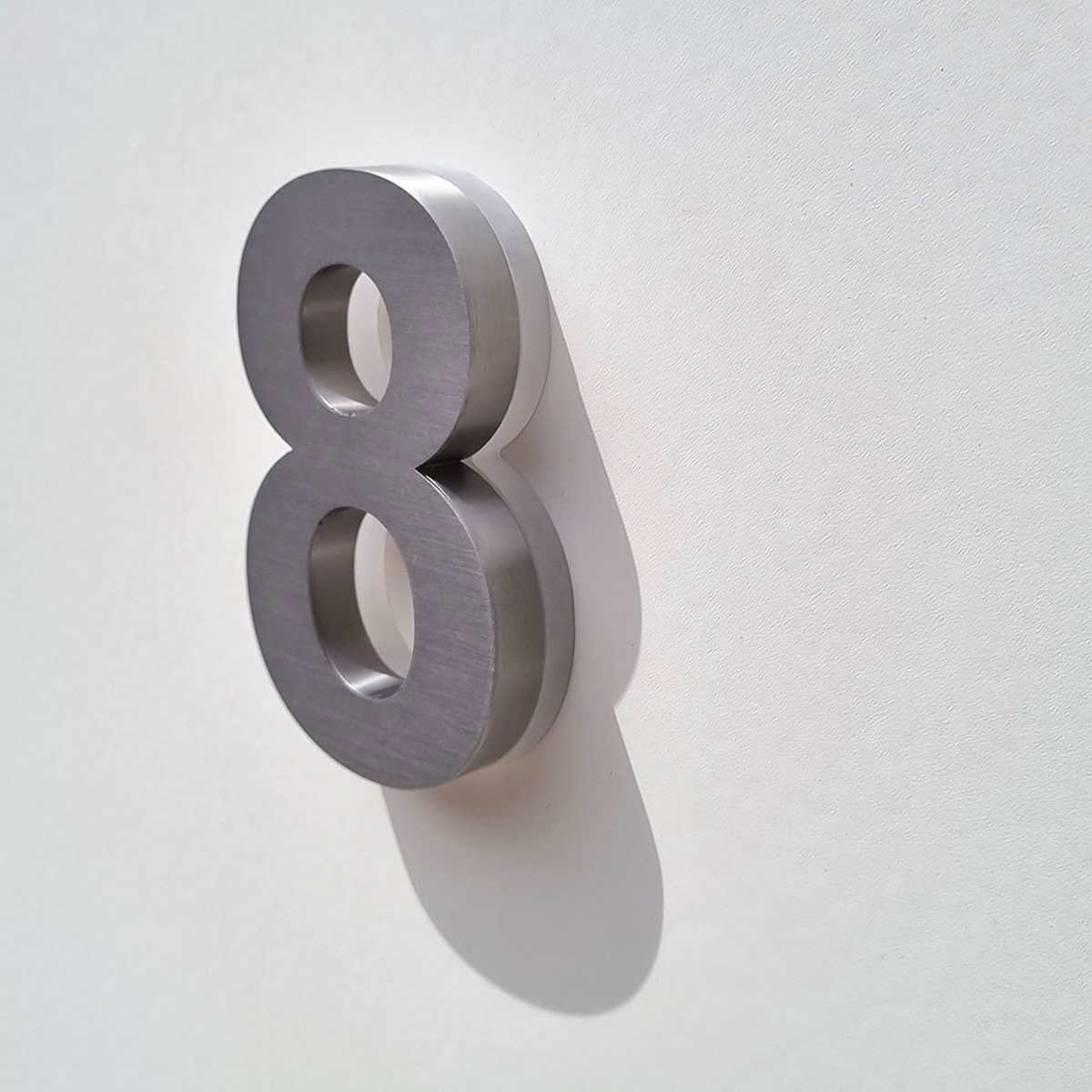Brushed silver stainless steel LED address numbers with halo lighting