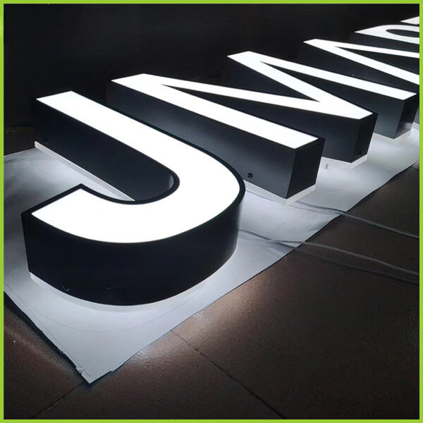 Custom manufactured letter B sign with white front and polished stainless steel returns