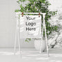 White A-frame welcome sign with floral decoration for weddings and events