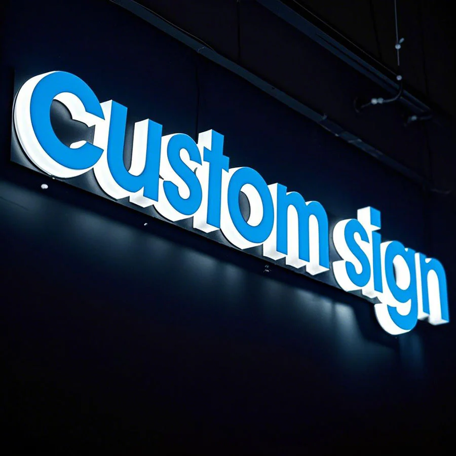 Custom illuminated acrylic letters glowing across the face and sides