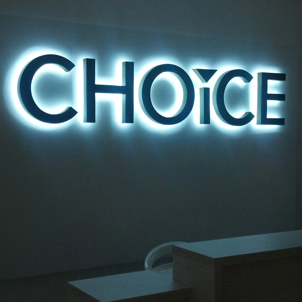 Exterior metal business sign with halo lit effect for premium architectural branding.