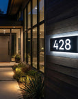 Modern house exterior with illuminated house number '428'