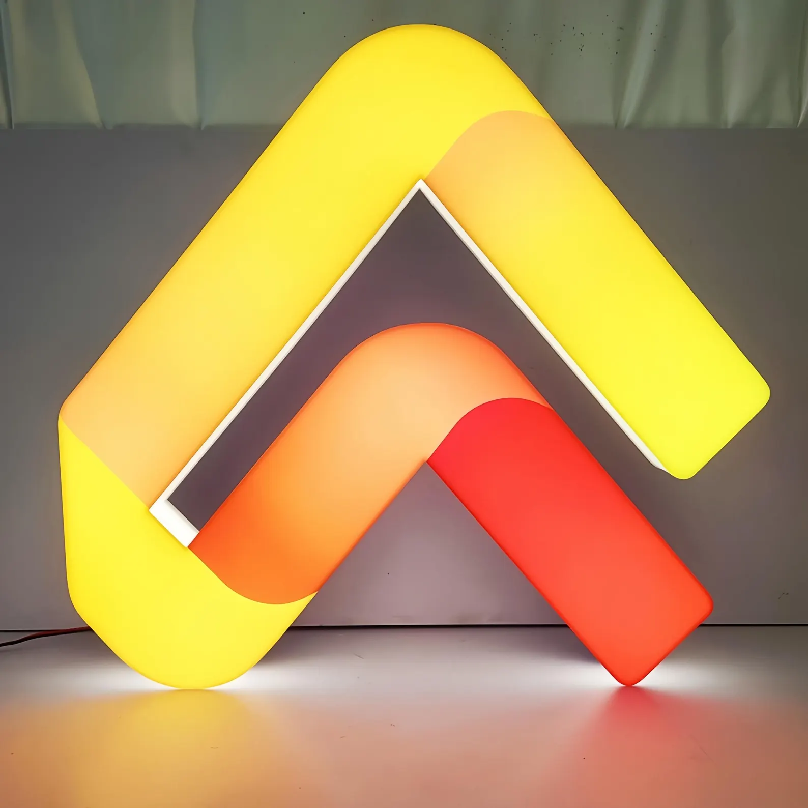 Glowing acrylic letter sign with light-diffusing acrylic construction