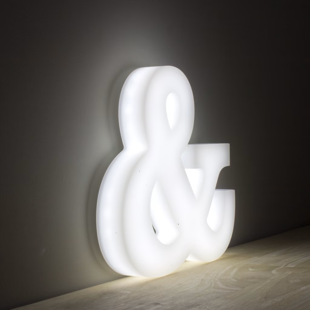 Close-up of a full lit acrylic letter showing the illuminated side