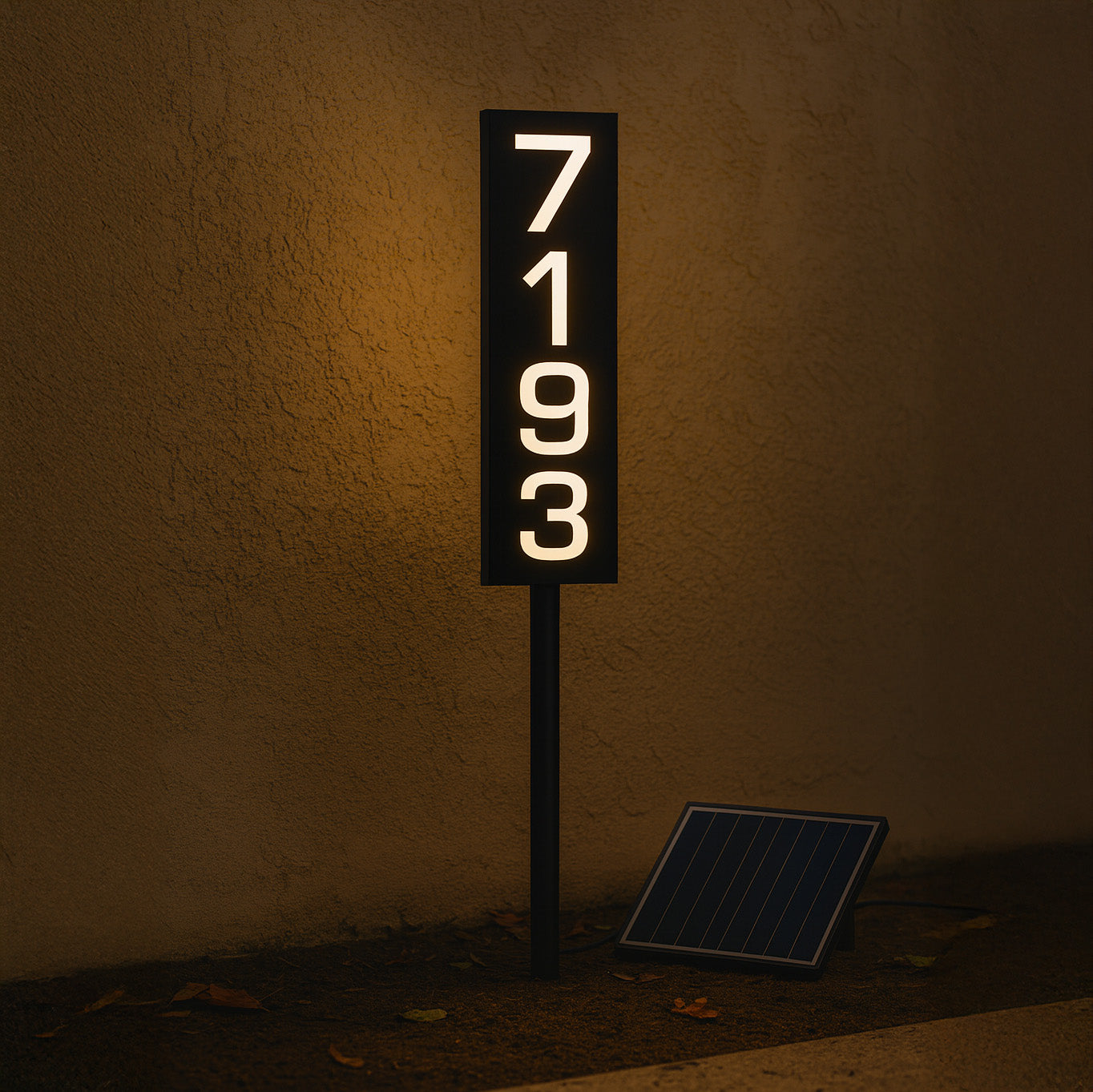 Solar-powered address sign with numbers '7193' on a dark background