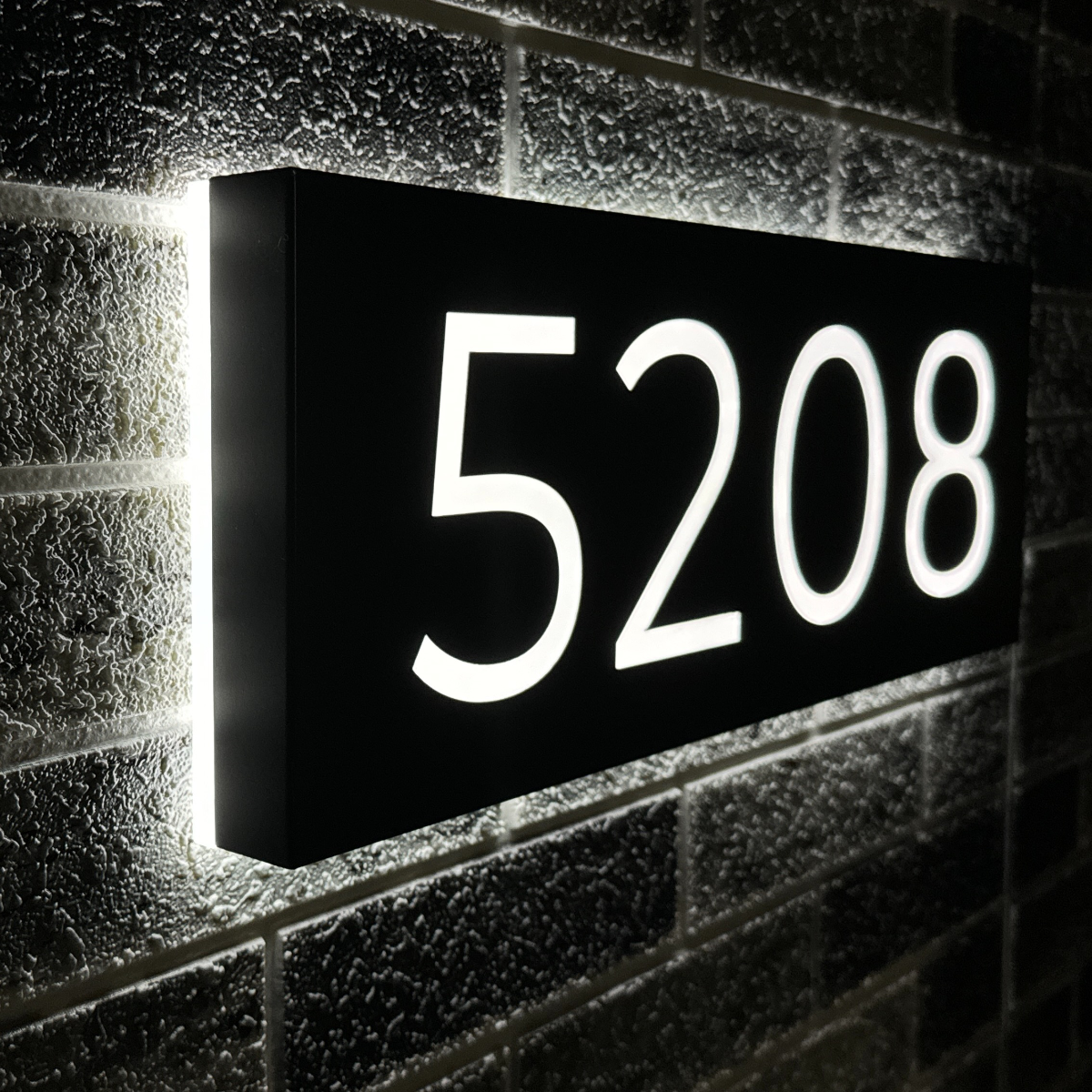 Large backlit address plaque displaying 5 digits for clear street visibility