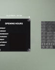 Black magnetic business hours sign, 10.24 inches / 26 cm square, shown with the changeable tile sheet