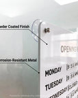 Corner detail of the white business hours sign showing the powder-coated steel panel and suction cup mount