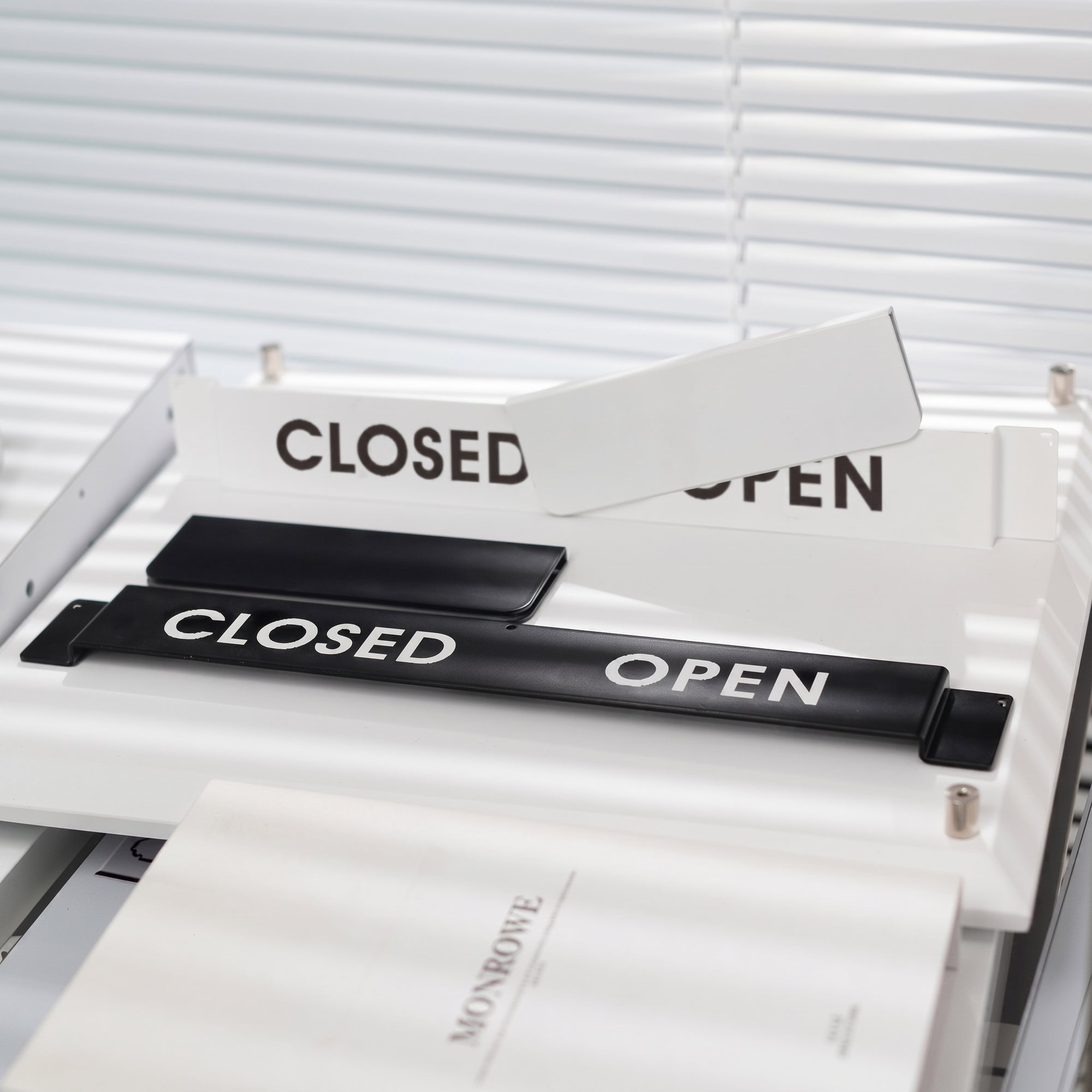 Open / Closed slider sign shown in matte white and matte black variants