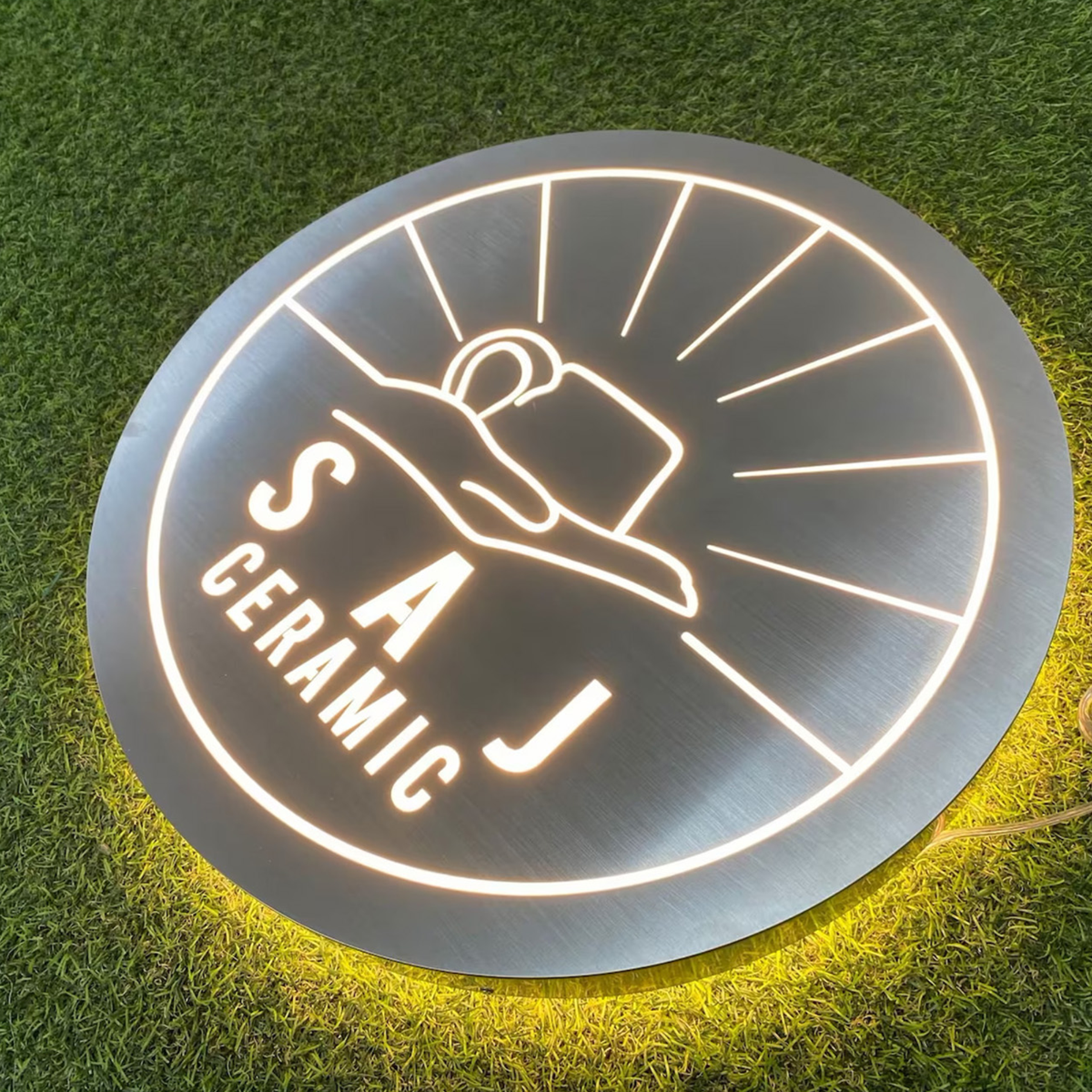 Durable stainless steel backlit business plaque with precise laser cut detailing