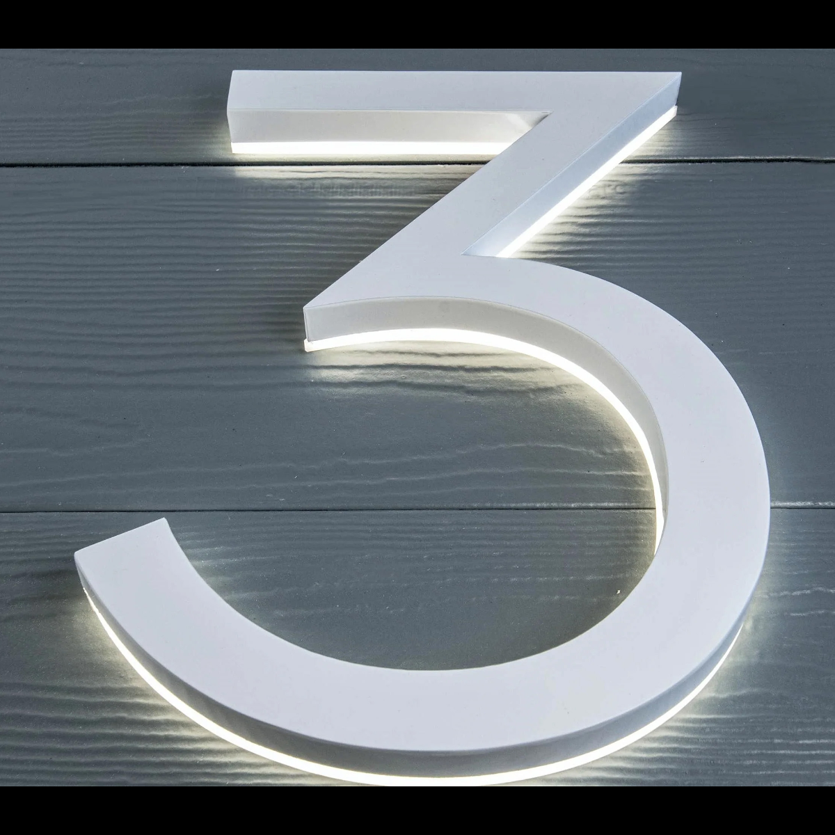 White acrylic LED house numbers modern font for dark exterior walls