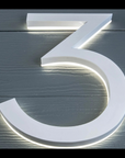 White acrylic LED house numbers modern font for dark exterior walls